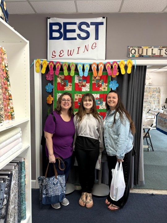 Florida Shop Hop 2026 visitor at Best Sewing & Vacuum's selfie booth, Jacksonville, FL.